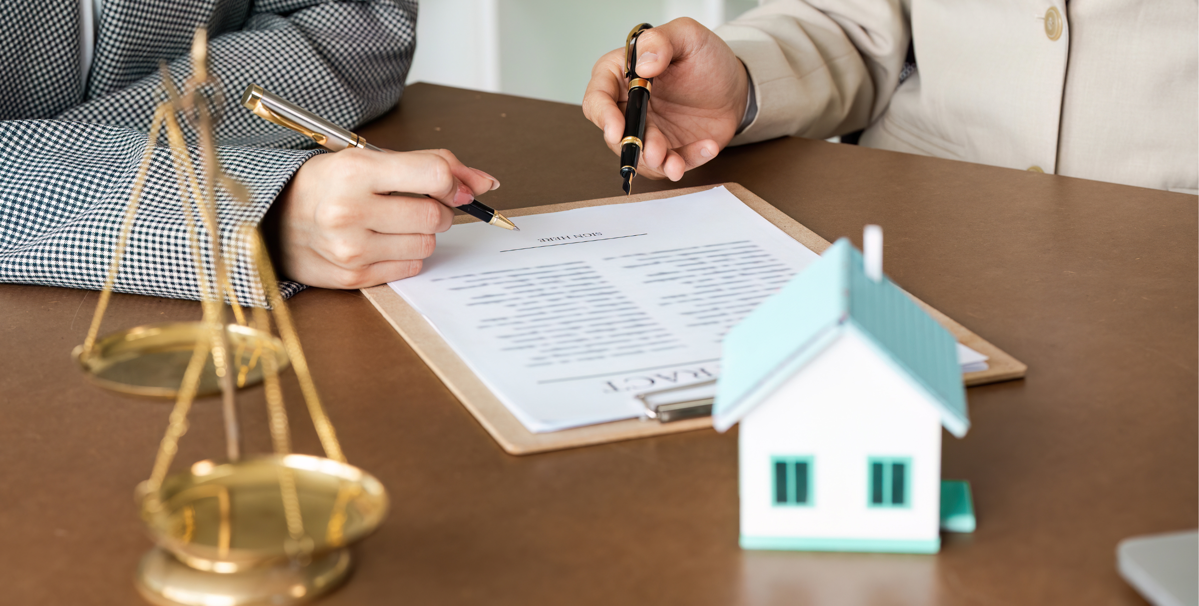 Couple reviewing a co-ownership agreement for property purchase