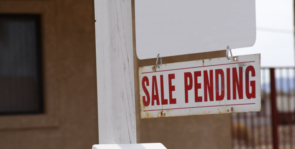 Sale Pending sign outside a Chicago residential home, representing a real estate deal in progress or at risk of falling through.