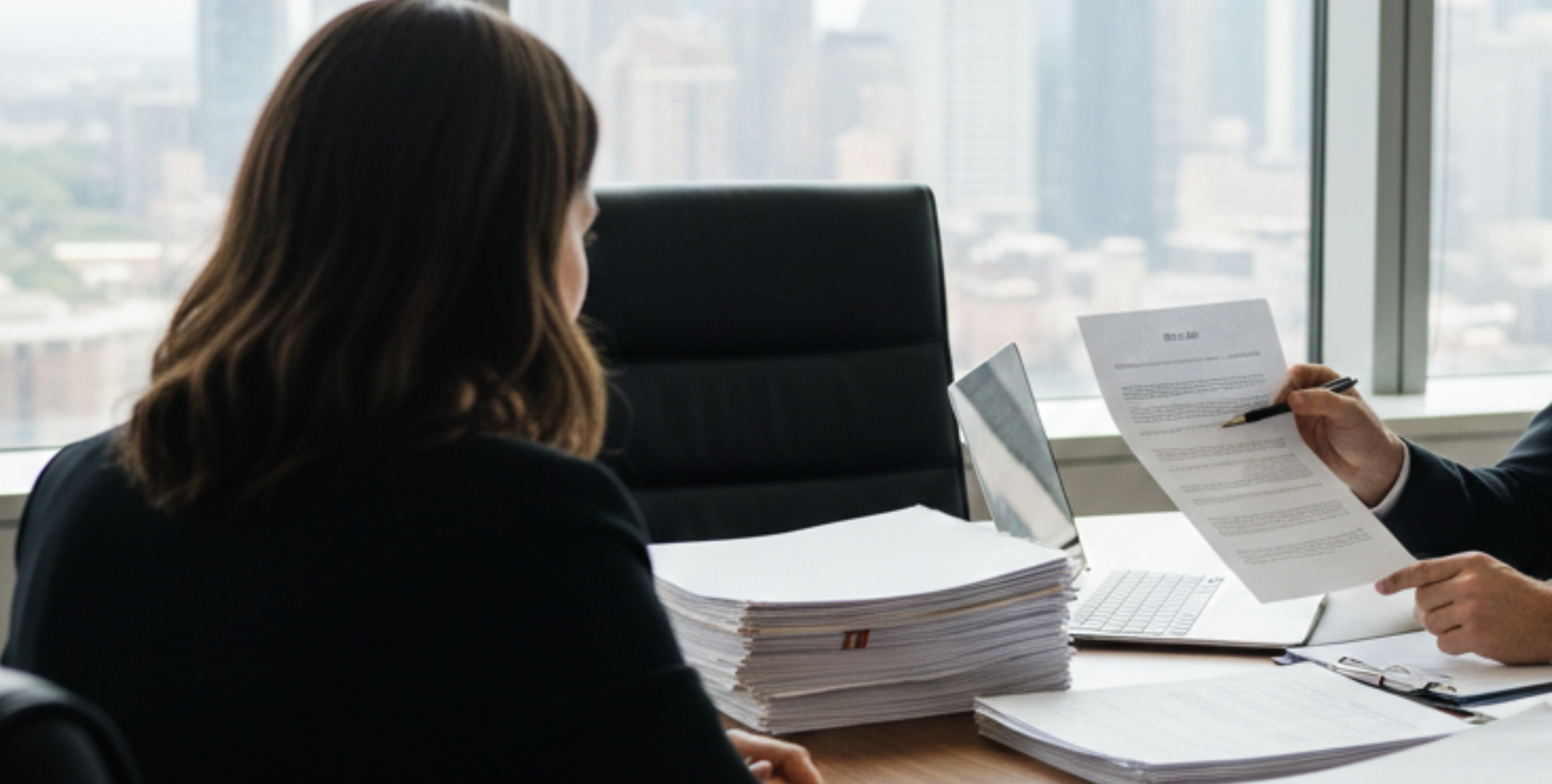 Attorney reviewing documents related to hidden title defects Chicago during a real estate consultation